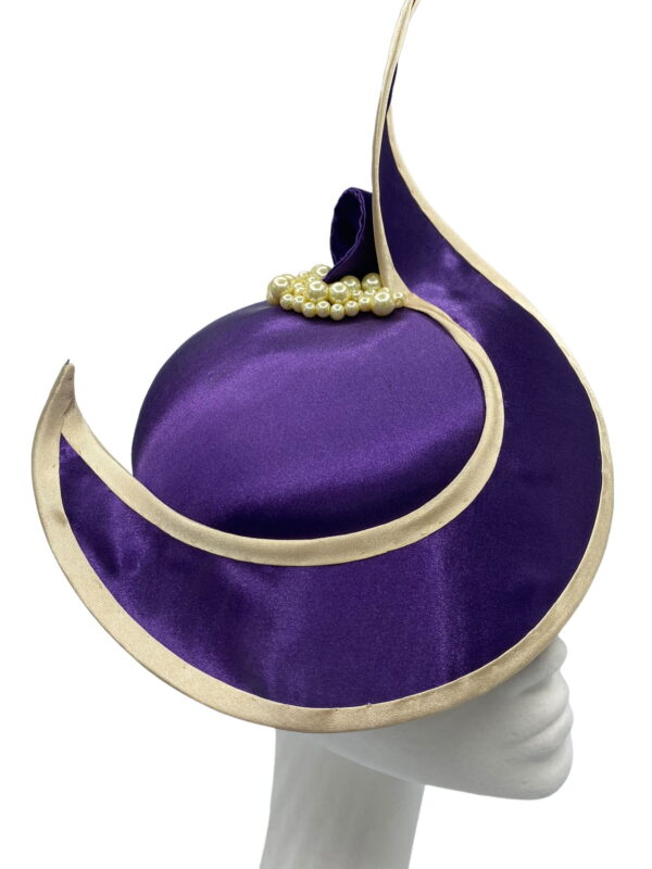Cadbury purple satin headpiece with purple swirl finished with a gold trim, pearl detailing to the back.